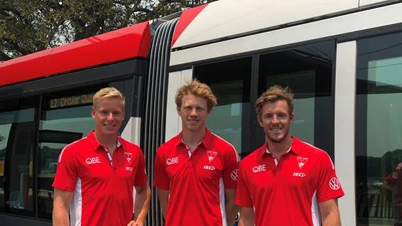 Isaac Heeney, Callum Mills and Luke Parker promoting the new travel deals.