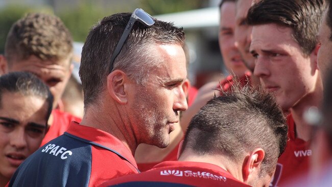 Demon's coach Brad Moore addresses his troops. Picture supplied.