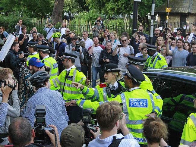 A crush outside the home of Boris Johnson in North London. Picture: AP Photo/Tim Ireland.