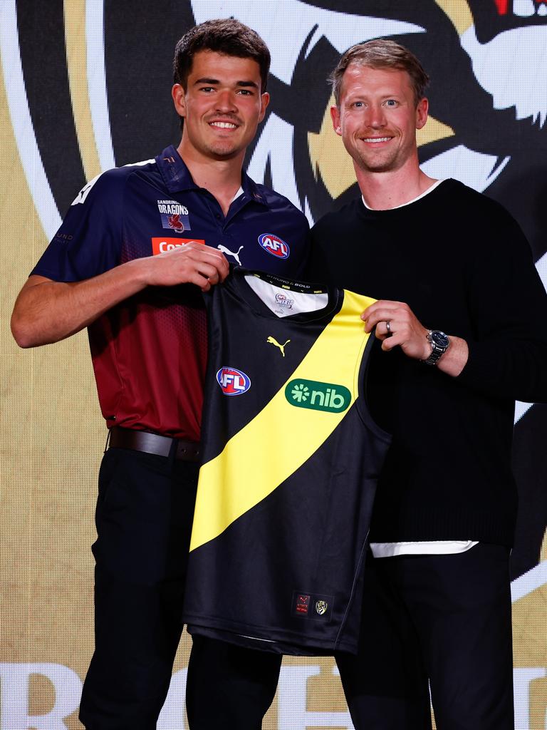 Dylan Grimes presents Harry Armstrong with his jumper.