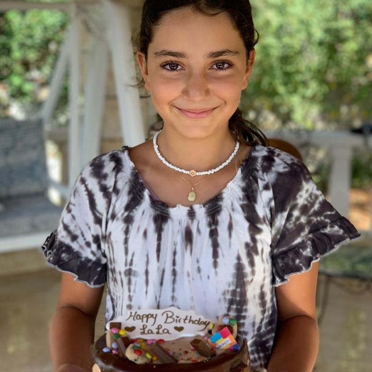 Sally Faulkner’s daughter Lahela poses with a chocolate birthday cake on her 11th birthday.