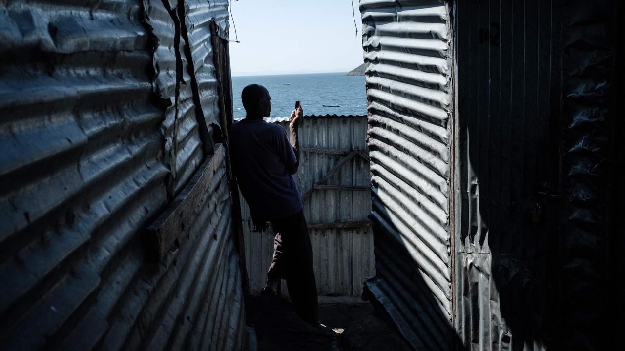 A man uses his mobile phone on the tiny island. Picture: Yasuyoshi Chiba/AFP