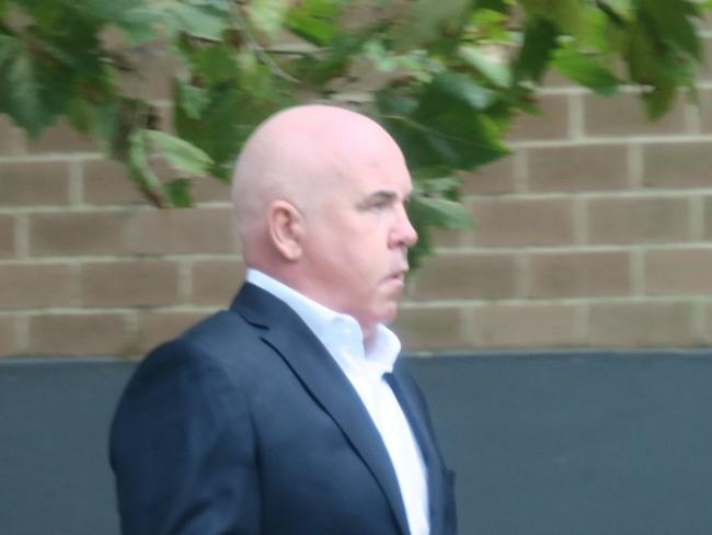 McGrath Terrigal principal Trevor James Hamilton, 50, arriving at Wyong Local Court where he pleaded guilty to intimidation after calling a rival agent and leaving a threatening voicemail. Picture: NewsLocal