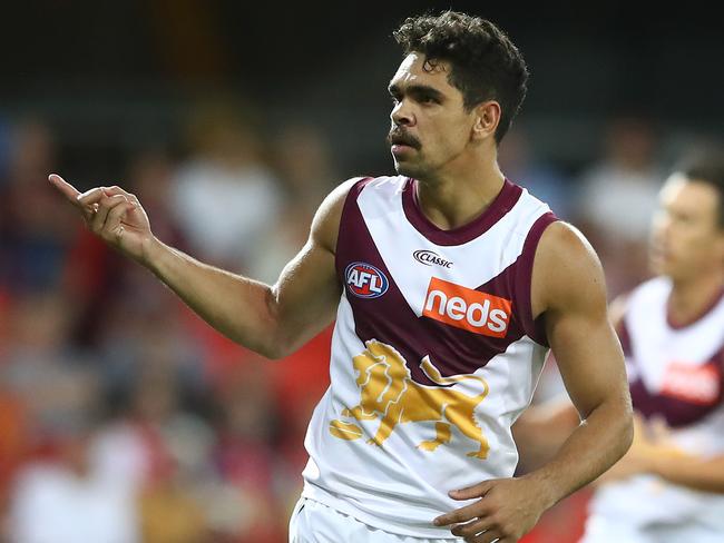 Charlie Cameron celebrates a goal as the Lions surge over the top of their rivals.