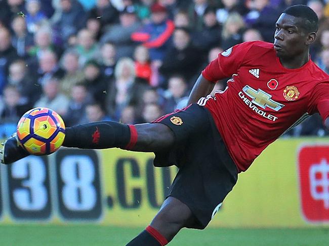 Manchester United's Paul Pogba scores his side's first goal during the Premier League soccer match between Swansea City and Manchester United at the Liberty Stadium, Swansea, Wales. Sunday Nov 6, 2016. (Nick Potts/PA via AP)