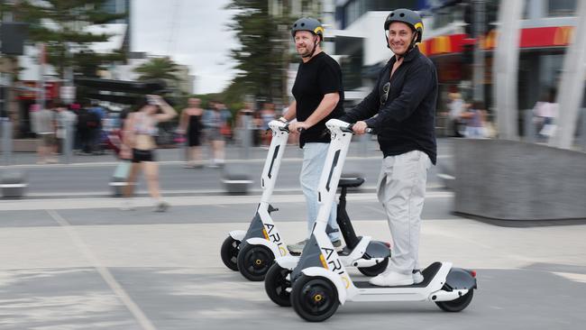 ARIO Head of Safety Clint Thorogood with Head of Communications Trent Williams on the new bikes. at Surfers Paradise. Picture: Glenn Hampson