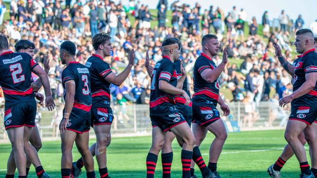 Collegians celebrate a try. Picture: Thomas Lisson.