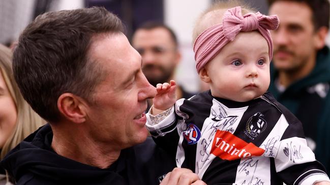 ADELAIDE, AUSTRALIA - APRIL 07: Craig McRae, Senior Coach of the Magpies is seen with daughter Maggie after the 2024 AFL Round 04 match between the Collingwood Magpies and the Hawthorn Hawks at Adelaide Oval on April 07, 2024 in Adelaide, Australia. (Photo by Michael Willson/AFL Photos via Getty Images)