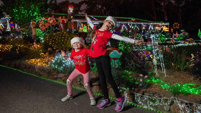 Sisters Elsie and Hattie Georgiou enjoying Peg and Bill Chartre’s Christmas lights display in Lobethal in 2022. Picture: Naomi Jellicoe