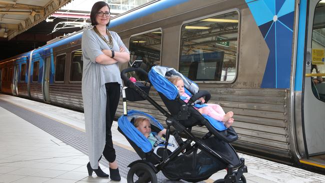 Safety station ... Nareena Bloomfield and her twin babies Rose and Laurel, 13 months, test out the new Britax E-Brake stroller. Picture: David Crosling