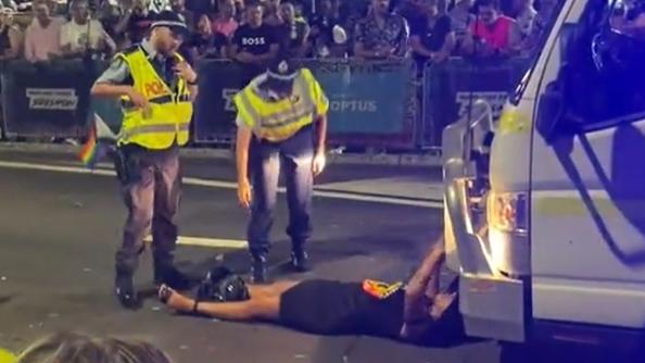 Lidia Thorpe lies in front of the Australian Federal Police float during the Sydney Mardi Gras.