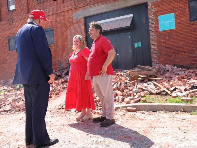 Donald Trump, speaks with Katie Watson and Patrick Watson, owners of Chez What Furniture store that was damaged during Hurricane Helene. Picture: Getty Images via AFP