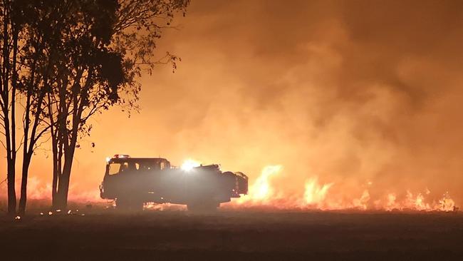 Multiple ground crews and aircraft are working to contain a large, fast-moving grass fire burning near the Chinchilla-Tara Road at Tara. Picture QFES