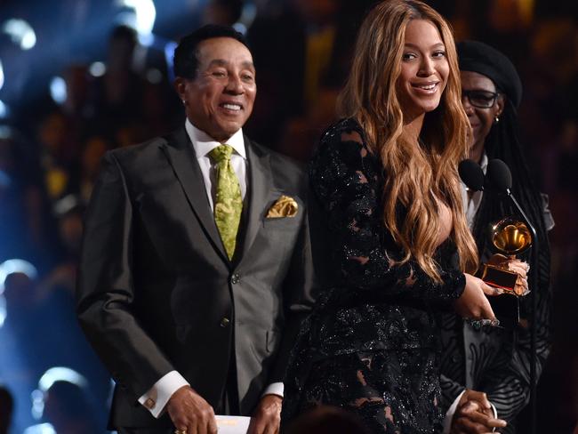 Queen Bey ... Smokey Robinson, left, presents Beyonce with the award for best R &amp; B performance for “Drunk in Love”. Picture: John Shearer/Invision/AP