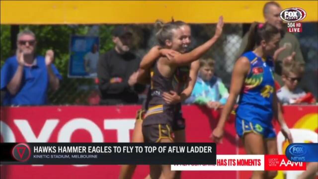 Hawks stay top after hammer win