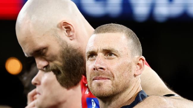 MELBOURNE, AUSTRALIA - SEPTEMBER 07: Simon Goodwin, Senior Coach of the Demons and Max Gawn of the Demons pause for the national anthem during the 2023 AFL First Qualifying Final match between the Collingwood Magpies and the Melbourne Demons at Melbourne Cricket Ground on September 07, 2023 in Melbourne, Australia. (Photo by Michael Willson/AFL Photos via Getty Images)