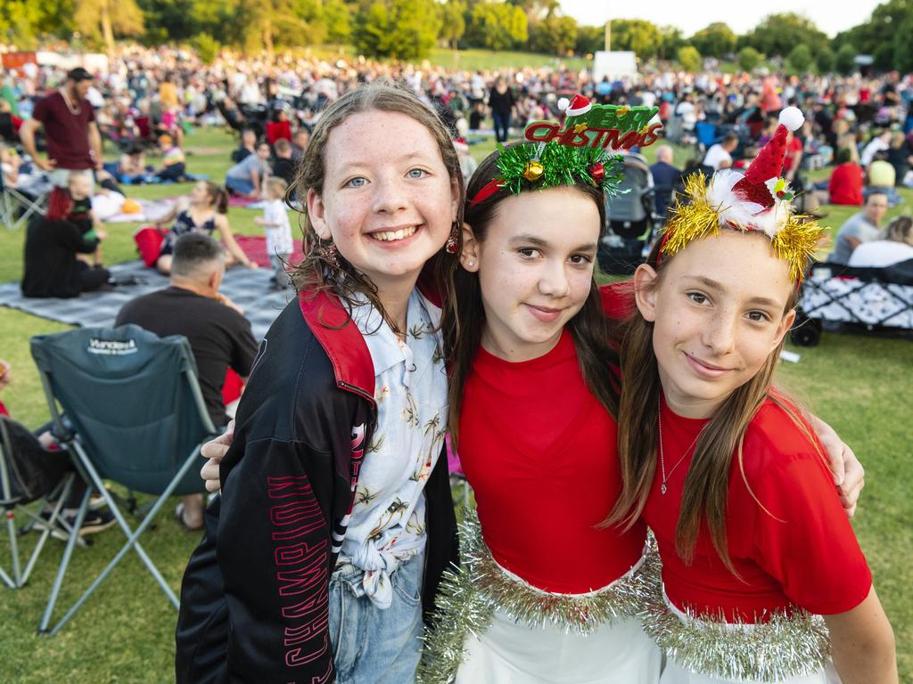 Showing their festive spirit are (from left) Maleah Kuss, India Macqueen and Alexah Alchin at the Triple M Mayoral Carols by Candlelight, Sunday, December 11, 2022. Picture: Kevin Farmer