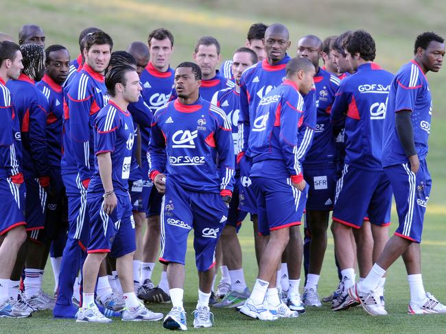 France's captain Patrice Evra (c) leads his team off the training pitch in protest of Anelka’s exclusion.