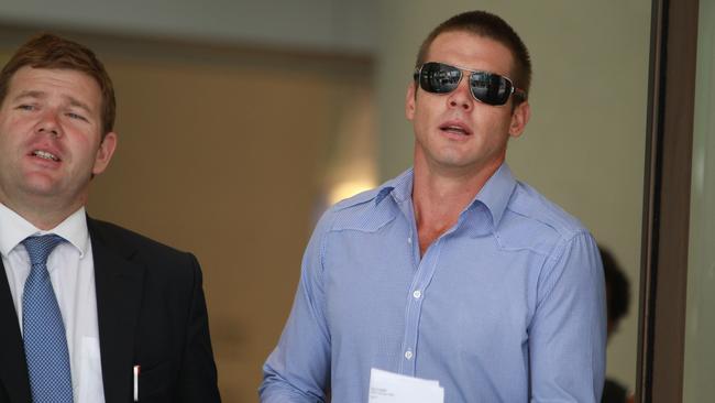 Former AFL player Ben Cousins with his lawyer Michael Tudori in 2012.