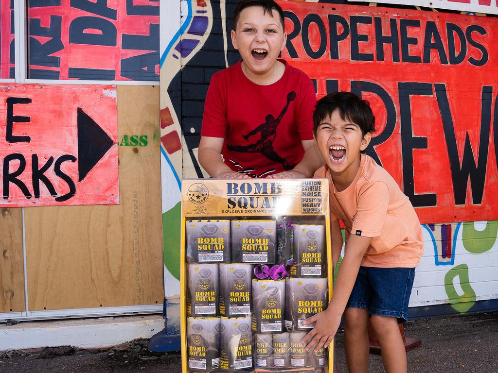 Octavius Cook, 9, and Daniel Cherry, 5, are stocking up with fireworks ahead of an explosive night of fun on Territory Day. Picture: Pema Tamang Pakhrin