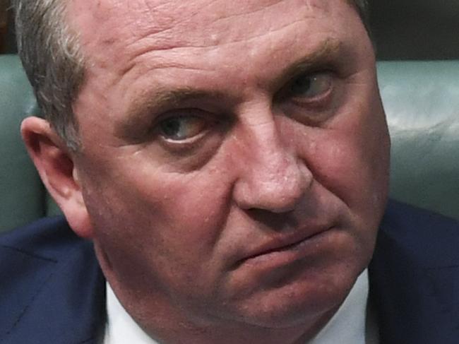 Australian Deputy Prime Minister Barnaby Joyce reacts during House of Representatives Question Time at Parliament House in Canberra, Thursday, February 8, 2018.  (AAP Image/Lukas Coch) NO ARCHIVING