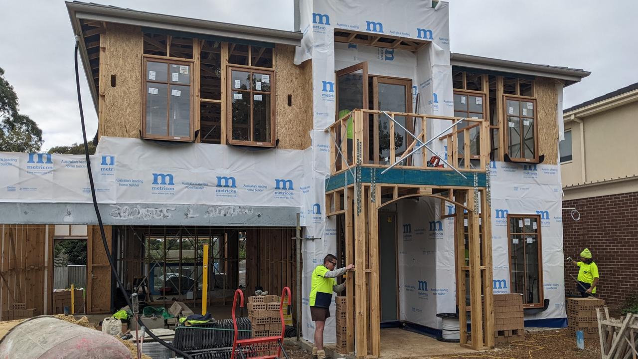 Workers on Metricon construction site on Avondale Grove, Mt Waverley. Picture: Kiel Egging