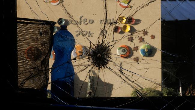 Following an attack by Hamas, a bullet hole is seen in the window of a bedroom at Kibbutz Holit. Picture: Getty