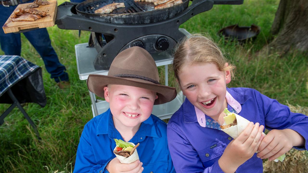 Cousins Dusty Kyle, 6, and Milli Kyle enjoying the quality meat that their family supplies to Coles. Picture: Supplied