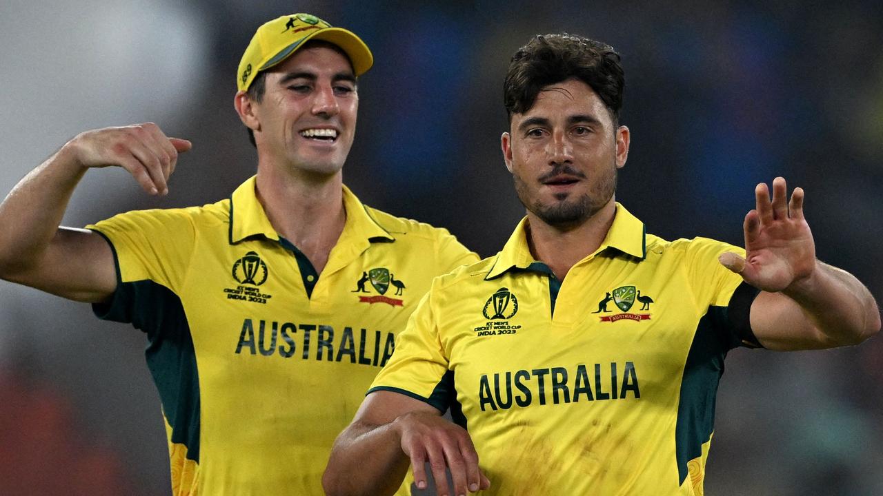 Australia's captain Pat Cummins and Marcus Stoinis. Photo by Punit PARANJPE / AFP