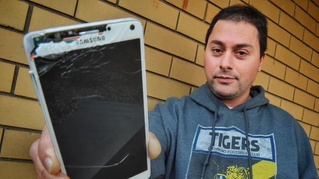 Richmond fan George Kalogiannis says he was bashed by security while trying to film supporters being kicked out of the MCG. Picture: Tony Gough                        Cats spoil Hodge's 300th