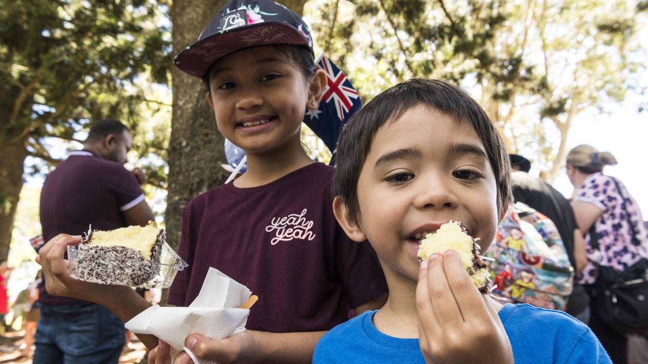 Enjoying their lamingtons are Mia Aws and Robert Henderson at Toowoomba Australia Day Awards and celebrations at Picnic Point, Tuesday, January 26, 2021. Picture: Kevin Farmer