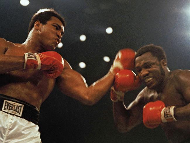 Boxers Muhammad Ali (L) and Joe Frazier fight in a 12-round non-title fight at Madison Square Garden in New York, 28/01/1974.