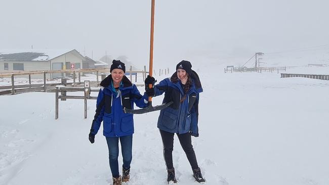 Ben Lomond Ski Lifts staff Jeanette Elms and Mahalia Smith enjoy the heavy snowfall on Tuesday.