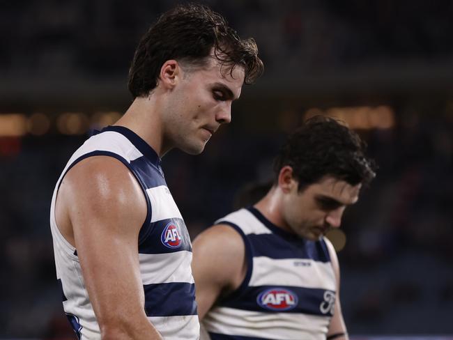 Dejected Geelong players walk from the ground after their loss to St Kilda on Saturday night. Picture: Darrian Traynor/Getty Images.