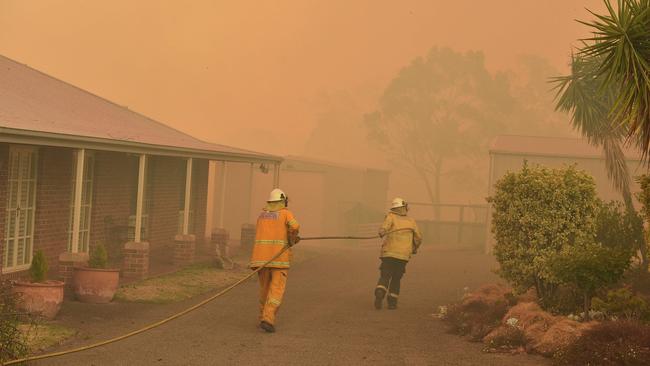 Deadly disasters like cyclones, floods and bushfires require wide-scale co-ordination, which is where ‘local government disaster management groups’ created under the Disaster Management Act 2003 come into place. (Photo by PETER PARKS / AFP)