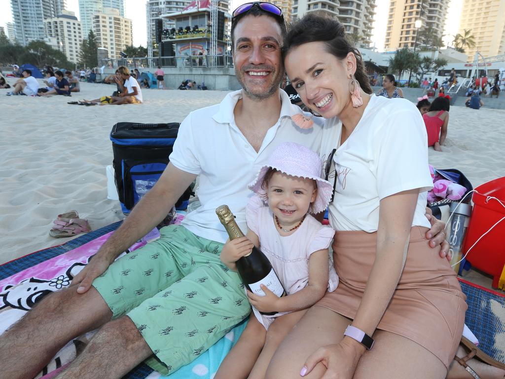 Pictured in Surfers Paradise for New Year’s Eve 2019. Paul Florat, Aurelia Florat-Jableka age 2 and Karina Jableka of Brisbane. Picture Mike Batterham.