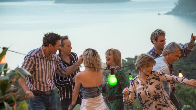 The view from the Palm Beach house. Aaron Jeffery, Richard E Grant, Claire van der Boom, Heather Mitchell, Sam Neill and Charlie Vickers in a scene from the movie Palm Beach. Supplied by Universal Pictures.