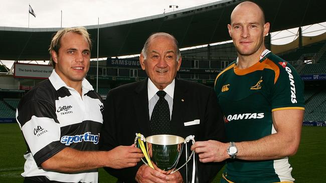 Barbarians captain Phil Waugh, Sir Nicholas Shehadie and Wallabies captain Stirling Mortlock pose with the Nicholas Shehadie Cup in 2009. Picture: Getty