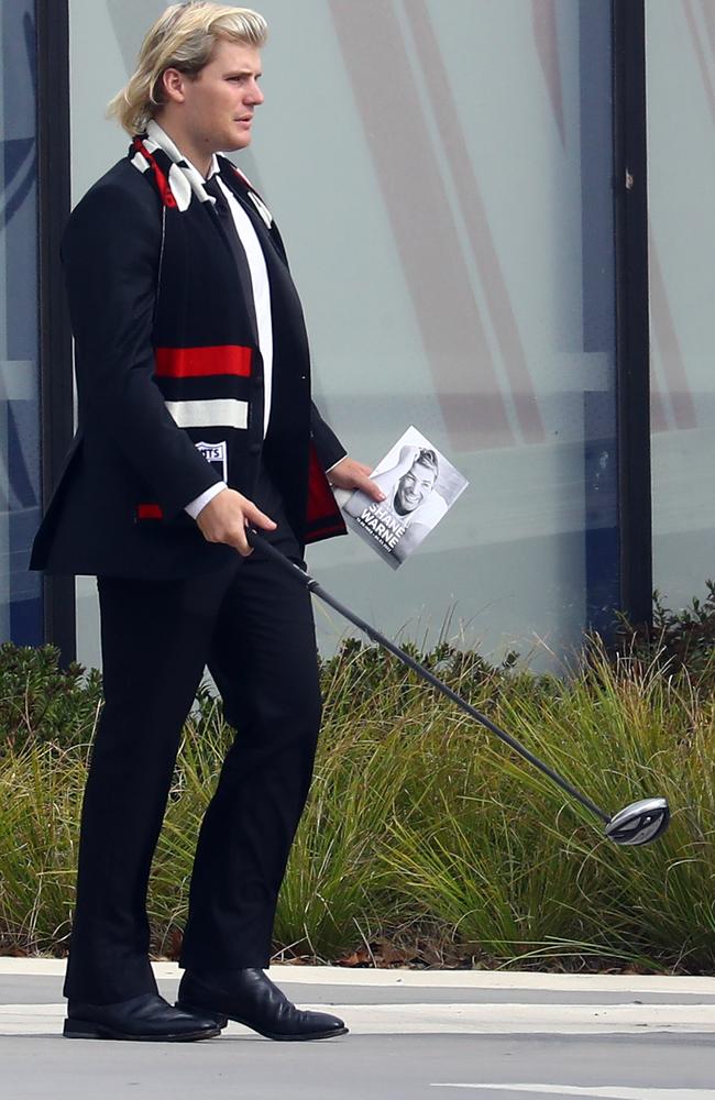 Jackson Warne could be seen carrying a golf club at his father’s funeral. Picture: Matrix