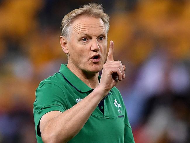 Ireland coach Joe Schmidt gestures during the team warm up prior to the First Test between Australia and Ireland at Suncorp Stadium in Brisbane, Saturday, June 9, 2018. (AAP Image/Dave Hunt) NO ARCHIVING, EDITORIAL USE ONLY