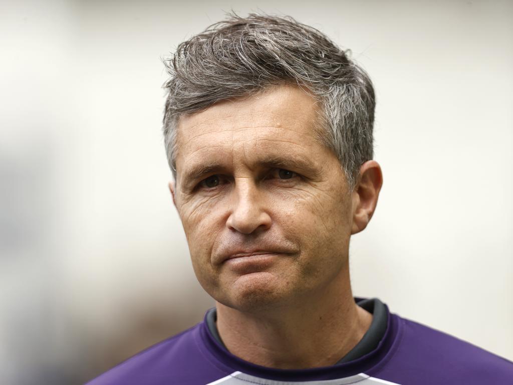 MELBOURNE, AUSTRALIA - AUGUST 26: Senior coach of the Dockers Justin Longmuir gives a media interview before the round 24 AFL match between Hawthorn Hawks and Fremantle Dockers at Melbourne Cricket Ground, on August 26, 2023, in Melbourne, Australia. (Photo by Darrian Traynor/Getty Images)