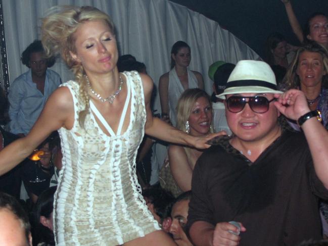 ONE TIME WEB USE ONLY - FEE APPLIES FOR REUSE -  **EXCLUSIVE** Paris Hilton and Taek Jho Low. Paris Hilton and Nicky Hilton with Taek Jho Low, Joel Rousseau and Unik Host Party in St Tropez. Cristal Champagne was been sprayed at everyone inside the Club. Papagayo Nightclub. St. Tropez, France. Friday, July 23, 2010. Photo By iSnaper.com/ CelebrityVibe.com To license this image please call (212) 410 5354; or Email: CelebrityVibe@gmail.com ;  website: www.CelebrityVibe.com  Picture: CelebrityVibe/BIG/Instar