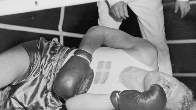 November 1956: A boxer is down for the count at Festival Hall during the Olympic Games. Picture: News Corp Australia