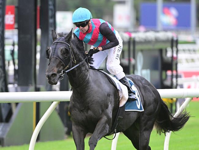 Vlad Duric powers to victory aboard Antino for trainer Tony Gollan in the Group 2 Victory Stakes at Eagle Farm. Picture: Grant Peters - Trackside Photography.