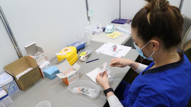 Medical worker prepares for the day with Covid-10 vaccinations. Picture: NCA NewsWire / David Crosling