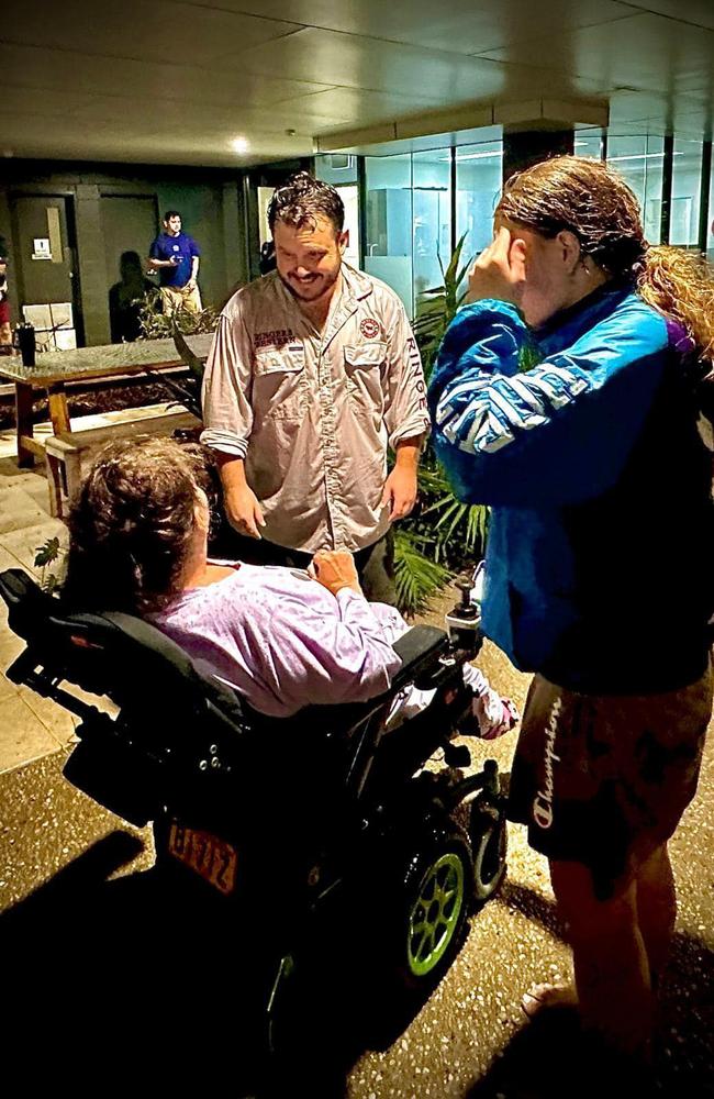 Federal Member for Townsville helping evacuate Pimlico resident Merissa from her unit on February 2. Picture: Facebook/Phillip Thompson