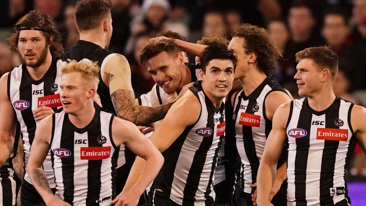 Jordan Roughead and the Magpies celebrate a goal on Friday night.