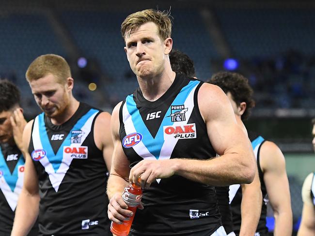 MELBOURNE, AUSTRALIA - AUGUST 17: Tom Jonas and his Power team mates look dejected after losing the round 22 AFL match between the North Melbourne Kangaroos and the Port Adelaide Power at Marvel Stadium on August 17, 2019 in Melbourne, Australia. (Photo by Quinn Rooney/Getty Images)