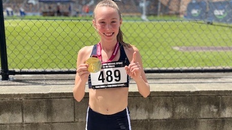 Emma Fryga of Somerville House with her 13 Years 800m Gold.