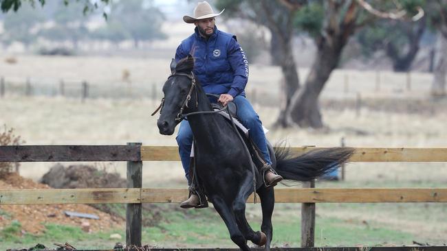 Gibson aboard his horse during campdrafting training. Picture: Michael Klein